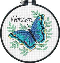 a blue butterfly with the words welcome on it