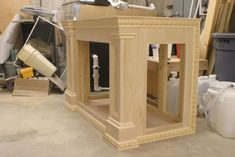 an unfinished wooden table with tools on it in a room that is being worked on