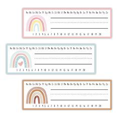 three rainbow themed name tags with numbers and hearts on the front, one for each child's name