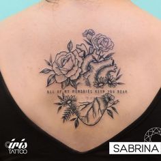 the back of a woman's neck with roses and an inscription that says, all my memories keep you near