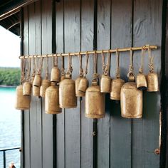 there are many bells hanging on the wall