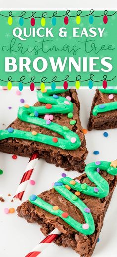 chocolate brownies with green frosting and candy canes in the middle on a white plate