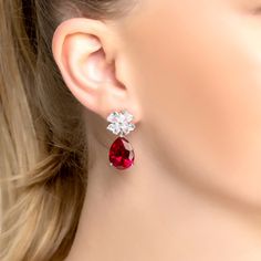 Introducing the beautiful Victoria Teardrop Earrings Silver Ruby! Featuring stunning lab-grown ruby gemstones, these earrings will be sure to turn heads. With an ornate fretwork setting to house the rubies, simulated diamonds, adorn a floral earring top, to add a touch of luxury. These beauties capture the perfect combination of elegance and sophistication.  The Ruby is the birthstone for July and symbolizes passion, courage and protection. This beautiful gemstone has been held in high regard th Elegant Pear-shaped Ruby Jewelry, Elegant Gemstone Earrings With Lab-created Ruby, Wedding Earrings With Lab-created Ruby Gemstone, Formal Pear-shaped Ruby Jewelry, Formal Lab-created Ruby Earrings, Pear-shaped Ruby Jewelry For Wedding, Ruby Teardrop Earrings For Formal Occasions, Ruby Teardrop Earrings Fine Jewelry, Elegant Red Earrings With Gemstone Accents