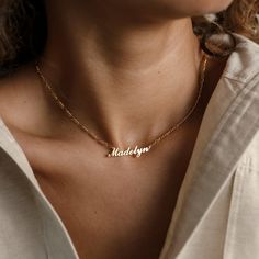 Our Carrie Name Necklace in Figaro Chain features a strikingly bold, yet minimal nameplate that hangs from a thick Figaro chain. The larger chain links lend this piece an effortlessly trendy and contemporary aesthetic. It's the perfect jewelry box addition to any modern, minimal style lover! • Material: High-Quality Solid 925 Sterling Silver• Dimensions: Depending on your font choice, height sizes range from 3mm to 4mm lowercase• Featuring High Quality 2mm Figaro Chain• Finish: Sterling Silver ∙ Minimalist Nameplate Jewelry, Everyday Adjustable Nameplate Jewelry, Modern Name Necklaces For Gifts, Modern Name Necklaces As Gifts, Minimalist Delicate Chain Necklace For Mother's Day, Simple Everyday Name Necklace, Delicate Custom Name Necklaces For Everyday, Minimalist Clavicle Chain Nameplate Necklace, Minimalist Adjustable Nameplate Necklace