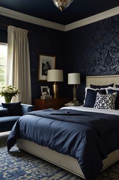 a bedroom with blue walls and white bedding, two lamps on either side of the bed