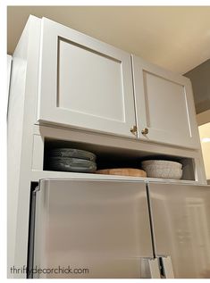 a white refrigerator freezer sitting inside of a kitchen