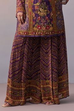 Purple kurta with printed floral-bird motifs, embellished by beads, sequins and front tie. Comes with chevron print sharara and dupatta. - Aza Fashions Semi-stitched Purple Sharara With Motifs, Purple Semi-stitched Sharara With Motifs, Festive Purple Sharara With Motifs, Bohemian Purple Sets With Zari Work, Bohemian Purple Sets With Dupatta, Bohemian Purple Set With Dupatta, Purple Motif Sharara For Diwali, Diwali Purple Sharara With Motifs, Diwali Purple Motif Sharara