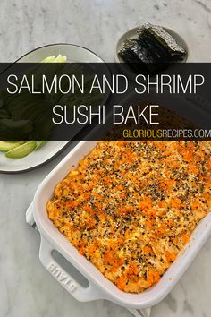 salmon and shrimp sushi bake in a white casserole dish on a marble countertop