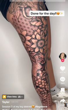 a woman's leg with an intricate tattoo on it