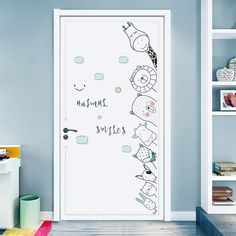 an open door in a blue room with children's drawings on the front and side