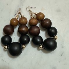 Beautiful Wood Bead Earrings With Gold Spacer Beads Fish Hook Style Measures 4” Long Black Beaded Drop Earrings With Large Beads, Black Large Beaded Drop Earrings, Adjustable Brown Earrings With Colorful Beads, Brown Wooden Beads Beaded Earrings As A Gift, Brown Beaded Earrings With Wooden Beads For Gift, Brown Wooden Beaded Earrings As Gift, Gift Brown Beaded Earrings With Wooden Beads, Adjustable Brown Beaded Earrings With Large Beads, Brown Beaded Hoop Earrings For Gift