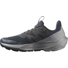 men's new balance running shoes in grey and black with white accents on the upper part