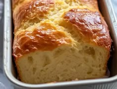 a loaf of bread in a metal pan