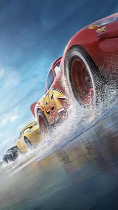 the cars are racing in front of each other and splashing through the water with their wheels