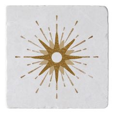 a white and gold square tile with an abstract star design on the center, in front of a white background