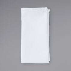 a plain white napkin on a gray background