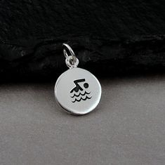 This Swimming Symbol Charm comes with a silver jump-ring as pictured. Please note that photo is not to scale and may appear larger to show detail. Refer to exact measurements below. Additional attachments (lobster clasp, large-hole bead, necklace chains) are available from the charm-attachments drop-down menu.  For a visual example of the different attachments and what each one is best suited for, scroll through the photos until you see the example photo or visit https://etsy.me/2BY7DAW for deta Swim Jewelry, Gifts For Swimmers, Swim Gifts, Large Hole Beads, Bead Necklace, Chains Necklace, Lobster Clasp, Charm Necklace, Etsy Accessories