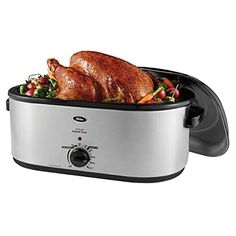 a roasting pan with roasted chicken in it