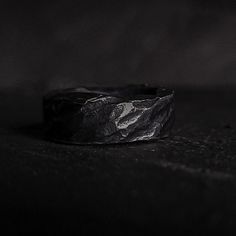 a black and white photo of a ring