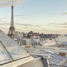 a view of the eiffel tower from top of a building