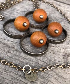 "Mid Century Modern Kaija Aarikka 1960s Pendant Necklace Marked \"Kaija Aarikka Finland\" MCM / Brutalist / Boho Style Pendant is made up by four beige/brown wooden balls and metal circles around them. It has a nice patina, which could be polished if so desired, and I believe it is silver plated. The chain is original Aarikka and it is marked. Please note that the wooden balls are not as yellow as they appear in some pictures but more of a beige/brown color and the most true color is in pic 7 an Handmade Retro Brown Necklaces, Retro Handmade Brown Necklaces, Retro Brown Handmade Necklaces, Unique Nickel Free Brown Necklaces, Vintage Brown Nickel-free Necklace, Handmade Vintage Brown Jewelry, Beige Brown Color, 60s Jewelry, Plate Design