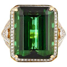 This is a simple yet stylish designer ring featuring a regal green tourmaline. This gorgeous gem is set in 18 Karat Yellow Gold, and accented with diamonds to elevate them to a truly must have piece! They are perfect to wear when you need to add a little bit of vibrance to an outfit. Green tourmaline and diamond ring in 18K yellow gold. Green Tourmaline: 15.67 carat octagon shaped. Diamonds: 0.31 carat, G colour, VS clarity. Gold: 6.17g, 18K yellow gold. Ring Size: US 6.5 - Size can be adjusted Elegant Yellow Gold Tourmaline Emerald Ring, Luxury Yellow Gold Tourmaline Emerald Ring, Luxury Green Diamond Ring With Gemstone Accents, Green Diamond Ring With Gemstone Accents For Formal Occasions, Formal Green Diamond Ring With Gemstone Accents, Formal Yellow Gold Emerald Ring, Luxury Green Tourmaline Emerald Ring, Luxury Tourmaline Emerald Ring, Queens Jewels