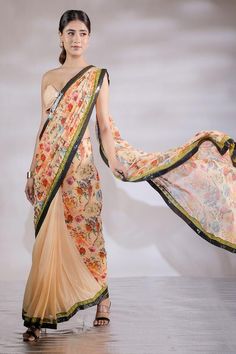 Multicolor floral print and sequin panel half half pre draped saree. Comes with padded tube blouse.
Components: 2
Pattern: Printed
Type Of Work: Floral
Neckline: Sweetheart
Sleeve Type: Sleeveless
Fabric: Georgette, Sequin georgette
Color: Multi Color
Other Details: 
Blouse front buckle detail
Length:
Blouse: 14.5 inches 
Saree :43  inches 
Model Height: 5ft 8inches wearing size S
Closure: Saree: Side zip
Occasion: Sangeet,Mehendi and Haldi - Aza Fashions Multicolor Blouse Piece With Sheer Dupatta For Reception, Fitted Dupatta With Digital Print For Reception, Multicolor Floral Print Dupatta For Reception, Fitted Pre-draped Saree With Floral Print For Festive Occasions, Floral Print Pre-draped Saree For Reception, Multicolor Silk Pre-draped Saree For Reception, Fitted Floral Print Pre-draped Saree For Navratri, Georgette Pre-draped Saree With Floral Print, Multicolor Floral Print Saree For Reception