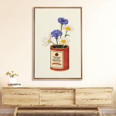 there is a painting on the wall with flowers in a red can and some daisies