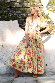 A true ode to bohemia, the Harmonia Maxi Dress is set to become an instant favourite in your Boho wardrobe. It’s soft, flirty and feminine, made from our signature super soft lightweight rayon and original hand drawn floral print. Available in three gorgeous colours, Dandelion, Pink Blossom and Khaki, featuring a frilled neckline and adjustable straps, this dress falls beautifully and flows and billows as you walk. A soft elastic waistband and drawstring, with our signature wind chimes tassels, Bohemian Flowy Floral Dress, Bohemian Flowy Floral Dress For Casual Wear, Casual Bohemian Flowy Floral Dress, Yellow Flowy Boho Maxi Dress, Flowy Yellow Boho Maxi Dress, Flowy Boho Dress For Spring Garden Party, Yellow Flowy Dress With Boho Print, Flowy Yellow Dress With Boho Print, Flowy Yellow Boho Print Dress