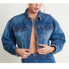 Be Ready Cropped Denim Jacket This Oversized Denim Jacket Is Sure To Edge Up Any Outfit. It Features A Raw Cropped Hem, 4 Button Closure, And Two Chest Pockets. -100% Cotton -Bust: 19” Length: 4.5” Sleeve Length: 19.5” (Measurements Taken From Size Small) -Model Is 5'8 1/2" And Wearing A Size Medium -Loose/Oversized Tags: Eveyday Outfit, Casual, Chic Style, Minimalist, Romance, Date, Love, Feminine, Elegant, Simple Trendy Oversized Medium Wash Denim Top, Cropped Medium Wash Denim Jacket For Winter, Winter Cropped Denim Jacket In Medium Wash, Oversized Medium Wash Denim Top For Fall, Fall Cropped Jacket In Medium Wash With Pockets, Cropped Dark Wash Denim Top For Fall, Trendy High Rise Denim Outerwear, Winter Cropped Medium Wash Denim Jacket, Dark Wash Cropped Denim Top For Fall