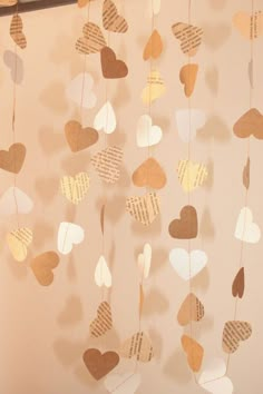 some paper hearts hanging from a string