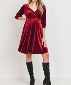 We can't get enough of this soft and beautifully flowing stretch velvet number for the holiday season into Vday! Looks flattering on all body types. Features a bonus opening for postpartum nursing-access. Color: Burgundy Above-the-knee Stretch Fabric: 92% Polyester 8% Spandex Maternity, Non-Maternity & Nursing-Friendly Size Chart Questions? Use the chat icon to connect with a stylist! Red V-neck Maternity Dress, Elegant Maternity Dresses For Winter, Elegant Maternity Winter Dresses, Elegant Christmas Velvet Dresses, Elegant Maternity Dress For Fall, Elegant Fall Party Maternity Dress, Postpartum Dresses, Velvet Green Dress, Postpartum Nursing