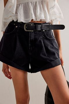 Perfectly pleated, these timeless denim shorts from our We The Free collection have the perfect touch of vintage-inspired charm. **Fit:** High-rise, relaxed tapered silhouette **Features:** Zip fly and button closure, five-pocket design, cuffed hemlines, rigid denim fabrication **Why We ❤ It:** Perfectly paired with a simple tee or elevated with a sheer blouse, these shorts have endless ways to wear. | We The Free Danni Shorts at Free People in Black, Size: L Black Denim Shorts Outfit, Woman Streetwear, Vintage Summer Outfits, Denim Shorts Outfit, Outfits Athletic, Summer School Outfits, Modest Summer Outfits, Black Jean Shorts, Simple Tees