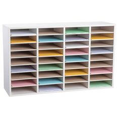 a white shelf filled with lots of different colored folders