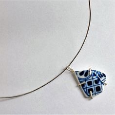 Sterling silver choker with a pendant of Delft ware porcelain, set in silver. The diameter of the necklace is 14 centimeters. Handmade Round Pendant Choker Gift, Artistic Sterling Silver White Necklace, Artistic White Sterling Silver Necklace, White Pendant Choker As Gift, Handmade Sterling Silver Pendant Choker, Nickel-free Sterling Silver Choker As Gift, Nickel Free Sterling Silver Choker For Gift, Silver Pendant Choker For Gifts, Handmade Silver Choker As A Gift