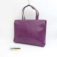 Prada Business Tote Bag Leather Purple Width (W) (Approx. Cm): 33 Height (H) (Approx. Cm): 26 Depth (D) (Approx. Cm): 7.5 Handle (Approx. Cm): 40 Purple Prada Handbag, Purple Tote Bag, Purple Design, Purple Bags, Tote Bag Leather, Prada Bag, Leather Tote Bag, Color Purple, Leather Tote