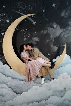 a man and woman are kissing on the moon