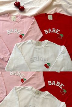 four shirts with the names babe, babe and cherries on them are laid out