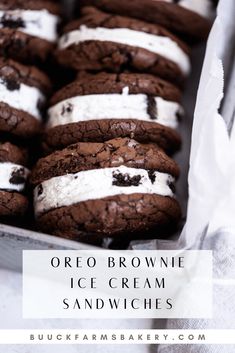 chocolate cookies with marshmallows and oreo cookies in a tin on a table