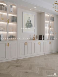 an empty room with white cabinets and gold trimmings on the doors, windows, and chandelier