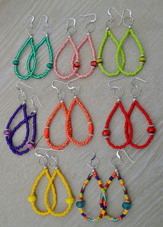 six pairs of beaded earrings on a table