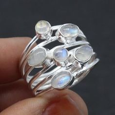 Elevate your style with our stunning Rainbow Moonstone ring. This handcrafted beauty features a mesmerizing Rainbow Moonstone set in a splendid sterling silver ring. *Captivating Colors: The Rainbow Moonstone's iridescent play of colours adds a touch of magic to your look. Each stone is carefully chosen for its unique charm. *Celestial Charm: The sterling silver moonstone setting adds a celestial touch, showcasing the moonstone in an elegant and timeless design. *Handcrafted Beauty: made by skilled artisans, each ring is a work of art that brings a special touch to your style. *Versatile Elegance: Whether for special occasions or everyday wear, this Moonstone ring is a versatile piece that adds a hint of mystique to any outfit. *Perfect Fit: Available in various sizes, ensuring a comfortab Wedding Ring Big, Big Wedding Rings, Strengthening Intuition, Huge Rings, Ring Moonstone, 925 Silver Ring, White Band, Silver Style, Multi Stone Ring