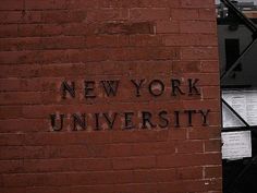 a brick wall with the words new york university written on it