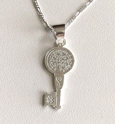 "925 STERLING SILVER SAINT BENEDICT KEY NECKLACE 20\" LONG... FOR GOOD LUCK ,PROSPERITY AND PROTECTION. MADE IN ITALY-BEST QUALITY PENDANT : 32x11mm CADENA DE SAN BENITO EN 925 PLATA ESTERLINA 20\" LARGO .. PARA PROSPERIDAD, BUENA SUERTE Y PROTECCION. HECHO EN ITALIA-MEJOR CALIDAD DIJE: 32x11mm" Personalized Silver Jewelry For Good Luck, Silver Key Pendant Jewelry, Silver Key Necklace For Gift, Silver Engraved Charm Necklace For Good Luck, Good Luck Silver Engraved Charm Necklaces, Good Luck Silver Engraved Charm Necklace, Good Luck Engraved Silver Charm Necklace, Silver Necklace With Two Keys For Gift, Silver Pendant Necklace With Two Keys