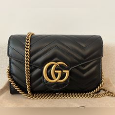 Authentic Gucci Marmont Small Shoulder Bag Soft Structure Design With Flap Closure Black Leather With Double G Hardware Chain Versatility For Shoulder Strap Or Top Handle Option Spacious Small Bag With Four Compartments Inside, One With Zipper Closure And Multiple Credit Card Slots. Only Used 2 Times For Special Occasion. Comes With Original, Box, Dust Bag And Purchase Receipt. Gucci Marmont Bag, Purchase Receipt, Gucci Women, Gucci Marmont, Structure Design, Small Shoulder Bag, Small Bag, Gucci Bag, Top Handle