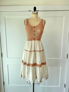 "Vintage paneled bohemian crochet summer dress with embroidered floral trim hem and adjustable waist. This is a super cute dress for a summer lunch or dinner and is in excellent vintage condition B: 33\" W: 24\" to 28\" L: 47\"" Fitted Crochet Sundress With Lace Trim, Lace Crochet Trim Sundress, Lace Crochet Sundress With Crochet Trim, Lace Crochet Sundress With Lace Trim, Crochet Lace Sundress With Lace Trim, Cotton Sundress With Lace Trim, Midi Length, Cotton Midi Sundress With Lace Trim, Cotton Lace Patchwork Dress For Vacation, Casual Crochet Midi Dress With Lace Trim