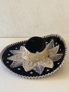 Vintage sombrero hat.  Black velvet/velour with silver trim and accents.  It's very stiff and good weight.  Has a double chin strap.  By Pigalle, made in Mexico.  Good vintage condition with normal wear. Measures 22 1/2" interior circumference Mariachi Hat, Sombrero Hat, Double Chin, Costume Hats, Silver Sequin, Costume Accessories, Black Velvet, Headpiece, Sequin