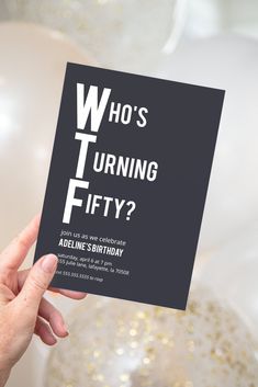 a person holding up a card with the words who's turning fifty? on it