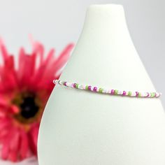 Add a colorful touch to your look with our Dainty Bracelet. Featuring pink, green, and white seed beads, this charming bracelet is perfect for adding a playful twist to any outfit. Trust us, your wrist will thank you! Materials:size 11/0 glass seed beadsbeading wiresilver plated crimp beadssilver plated wire guardssilver plated lobster claw claspsilver plated extension chainsilver plated logo charm Charming Bracelet, Double Wrap Bracelet, Dainty Bracelet, Dainty Bracelets, Seed Bead Bracelets, Pink Bracelet, Gemstone Bracelets, Instagram Shop, Green And White