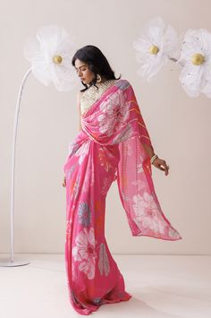 The indo-western set comes with a heavily embroidered blouse with attached pallu and a mid drape skirt. The blouse and the attached pallu is adorned with sequins and pearls. Embellished Pink Pre-draped Saree For Festivals, Pink Semi-stitched Embellished Blouse Piece, Pink Embroidered Fitted Pre-draped Saree, Pink Pre-draped Saree With Printed Border, Semi-stitched Embellished Pink Pre-draped Saree, Mirror Saree, Golden Saree, Saree Style, Lehenga Suit